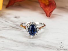 a ring with a blue stone in the center