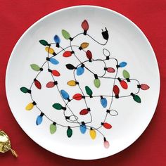 a white plate with christmas lights on it