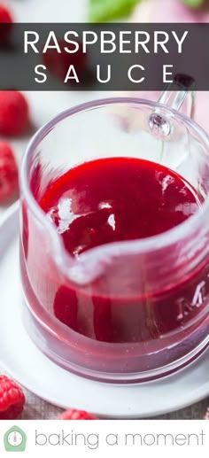 raspberry sauce in a glass jar on a plate