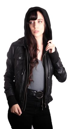 Women's leather jacket with a hoody. Slim-fit women's leather jacket. Zippered mid-section. Detachable Mid-Section cotton fleece with hoodie hoodie. Two exterior pockets with flaps. Rib on wrists and waistline. Soft, supple leather Genuine leather. This women's leather jacket is soft, warm, and comfy. You will be looking classy and snug through the winter months in this leather jacket. Two Front Snap Button Chest Pockets Two Lower Diagonal Zippered Hand Warmer Pockets Zippered Removable inner Mi Winter Hooded Leather Jacket, Fitted Hooded Biker Jacket With Pockets, Winter Fitted Biker Jacket With Double-lined Hood, Fitted Biker Jacket With Double-lined Hood For Fall, Leather Jacket With Double-lined Hood, Hooded Leather Jacket With Zipper For Fall, Winter Biker Jacket With Double-lined Hood, Fitted Biker Jacket With Detachable Hood For Winter, Fitted Leather Jacket With Detachable Hood For Fall