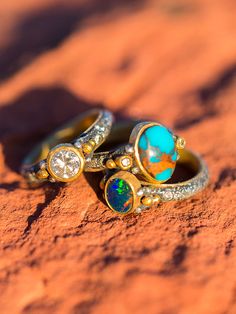 Our new Brit West Bride rings are hot, hot, hot! Gem quality Royston turquoise, fire opal, raw diamond, or your diamonds! Wear these as an accent ring or your wedding bands. Each band is custom, and we encourage you to send your own diamonds if you want to use them. I can shop a diamond for you, but I chose to use my mothers diamonds in mine. Several clients have sent their rings for redo! Each ring starts at $1198 in Sterling and 22K gold. Check out or Brit West Bride Cuff to accent the rings! Bride Rings, Royston Turquoise, Raw Diamond, 22k Gold, Metal Jewelry, Fire Opal, Turquoise Ring, Wedding Bands, Opal