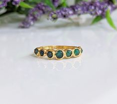 This listing is for this Exact size 6 raw Emerald ring. Our multi-stone ring features 5 small raw Emeralds that are set by electroforming on a 2mm 14k Gold filled band. T H E ∙ S M A L L ∙  D E T A I L S * Five (5) small raw natural Emeralds  * 2mm 14k Gold filled band 🎁 P A C K A G I N G  &  G I F T I N G  Your ring will come to you wrapped with great care in a lovely handmade gift box - However, if you would like to upgrade your Gift box to a more luxurious one, please select one of these lov Gold Emerald Wedding, Wedding Ring Green, Green Crystal Ring, Raw Emerald Ring, Stone Wedding Ring, Emerald Wedding Band, May Birthstone Rings, Raw Emerald, Emerald Ring Gold