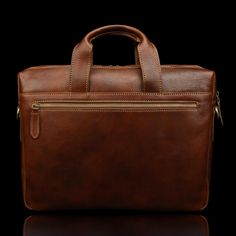 Made both for business and everyday life, our Essential modern briefcase has you feeling confident when carrying around everyday necessities like laptops, books, refreshments—you name it. Handcrafted in Florence, Italy by experienced craftsmen in family-owned studios, this briefcase is known for turning heads for all the right reasons. The irresistibly sleek design features full-grain cow leather with a solid brass hardware finish. On top of that, it is fully lined with fine cotton canvas. You'l Classic Brown Bags With Pen Slots, Brown Classic Bag With Pen Slots, Timeless Rectangular Briefcase For Daily Use, Rectangular Briefcase With Pen Slots For Everyday Use, Modern Rectangular Bag With Pen Slots, Classic Cases With Pen Slots, Classic Cases With Pen Slots For Daily Use, Classic Cases With Pen Slots For Everyday Use, Modern Brown Briefcase With Laptop Sleeve