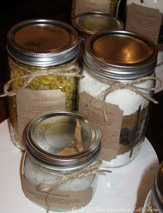 several jars filled with food sitting on top of a table