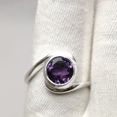 Natural Amethyst Ring, Faceted Round Shape Gemstone Ring, Handmade Amethyst Jewelry, 925 Sterling Silver Purple Cut Stone Ring  Material: Silver Gemstone: Amethyst Gem color: Purple  Stone Shape: Round Stone Type: Cut  Band color: Silver Ring Weight: 3.62gm ABOUT GEMSTONE:- Amethyst is linked to the element of wind.It is believed to prevent intoxication.This purple gemstone is associated with Royalty.This stone has amazing healing power and very helpful in purifying the mind and relieving stress Sterling Silver Amethyst Ring With Accent Stones, Adjustable Amethyst Ring With Accent Stones, Formal Sterling Silver Amethyst Open Ring, Purple Amethyst Ring In Sterling Silver, Purple Sterling Silver Birthstone Ring, Silver Amethyst Birthstone Ring, Amethyst Round Stone Fine Jewelry Ring, Purple Amethyst Ring With Sterling Silver, Amethyst Rings Fine Jewelry