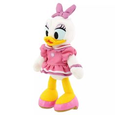 a stuffed toy duck wearing a pink dress