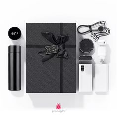 the contents of a black and white gift box