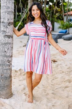 Honestly, this dress is perfect for almost any event! It's a little casual, a lot cute and easily dressed up! We are in love with those colors too! This dress features a round neckline, pockets, short sleeves, a babydoll fit, and a unique striped print. Material has generous amount of stretch.Cindy is wearing the small. Multicolor Summer Dress With Pockets, Summer Multicolor Midi Dress With Pockets, Spring Crew Neck Dress With Pockets, Pink Vacation Dress With Pockets, Pink Dress With Pockets For Vacation, Crew Neck Dress For A Spring Day Out, Crew Neck Dress For Spring Day Out, Summer Dresses With Pockets And Crew Neck, Summer Day Out Crew Neck Dress