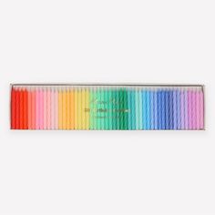 the rainbow colored pencils are lined up in a row