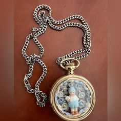 New Handcrafted Gold Tone Pocket Watch Pendant Necklace On Silver Tone Chain. Features Charming Little Boy Holding Rabbit Accented By Pearls And Lace. New, Excellent Condition. Vintage Gold Pocket Watch In Stainless Steel, Silver Pocket Watch With Locket, Silver Stainless Steel Pocket Watch As Gift, Vintage Silver Stainless Steel Pocket Watch, Gold Metal Pocket Watch With Chain, Elegant Silver Metal Pocket Watch, Vintage Silver Pocket Watch With Chain, Vintage Silver Stainless Steel Necklaces, Gold Chain Watch As A Gift