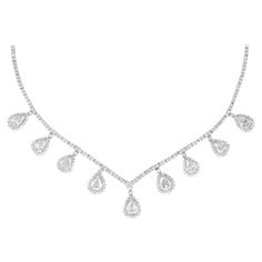 Exquisite dangling old pear cut diamond high jewelry necklace. 390 diamonds total, 15.91 carats total. 9 old pear cut diamonds 9.81ct, approximately I/J color and VS2/SI1 clarity. 381 round brilliant diamonds 6.10ct, approximately H/I color and SI clarity. Prong set in 18k white gold. Accommodated with an up-to-date appraisal by a GIA G.G. once purchased, upon request. Please contact us with any questions. Item Number N6171