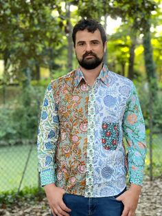 This funky patchwork 100% cotton shirt is handmade and block printed. It features long sleeves and a pocket in an upper left side. It closes by buttons. This shirt is free from the dictates of mass production being handmade by skilled woodblock artisans using exclusively local high quality cotton. It is somehow exotic, funky and fun but at the same time stylish in an own particular way. SIZE Shoulders 50 cm Chest 116 cm Sleeve 61 cm Length 75 cm This item is handmade so it may present minor irre Patterned Patchwork Long Sleeve Tops, Spring Patchwork Patterned Shirt, Multicolor Long Sleeve Printed Shirt, Multicolor Printed Long Sleeve Shirt, Long Sleeve Cotton Shirt With Patchwork, Cotton Long Sleeve Shirt With Patchwork, Multicolor Cotton Patchwork Shirt, Relaxed Fit Long Sleeve Shirt With Patchwork, Patterned Relaxed Fit Long Sleeve Shirt