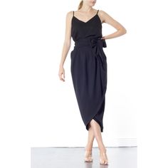 The Blake Tulip skirt is super flattering on any size. Coming in one size fits all, this wrap-around tulip style is designed to sit high on the waist. It's finished with a wrap-around belt that ties at the side, to nip in your waist for a flattering effect. Tie into a bow or leave as it is. This dramatic outline is best complemented with a fitted top. Hand wash recommended Wash with like colours to avoid colour transfer Press on reverse side Iron on low heat  100% polyester Chic Asymmetrical Pencil Skirt For Date Night, Chic Lined Wrap Skirt, Spring Wrap Skirt With Tie Waist, Chic Wrap Skirt With Lined Detail, Chic Wrap Skirt With Lined Skirt, Elegant Black Skirt For Brunch, Chic Wrap Skirt With Lining, Asymmetrical Tie Waist Relaxed Skirt, Asymmetrical Relaxed Skirt With Tie Waist