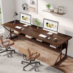 a computer desk with two monitors on it and three chairs in front of the desk