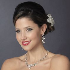 Silver Plated Freshwater Pearl Jewelry SetThe beautifully detailed bridal necklace and earring set features lustrous freshwater pearls and sparkling cz crystals. The elegant floral dsign of this jewelry set makes it the perfect accessory for your wedding day!The earrings are for pierced ears.Size:  Necklace Length is about 6" long and the Earring Length is about 2 3/4" long.Color: Silver/Light ivory.Style: nedr213.Please allow 1 week for delivery.Shipping Policy.Return Policy. Elegant Pearl Bridal Sets With Pearl Drop, Elegant Pearl Bridal Sets For Weddings, Silver Pearl Bridal Accessories For Bride, Wedding Crystal Jewelry Sets With Pearl Drop, Silver Pearl Bridal Accessories, Wedding Crystal Pearl Drop Jewelry Sets, Elegant Pearl Drop Bridal Set For Wedding, Crystal Pearl Drop Jewelry Sets For Wedding, Silver Pearl Drop Bridal Accessories