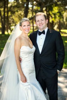 a bride and groom posing for the camera