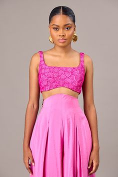 HAND-EMBROIDERED SLEEVELESS CROP TOP Material: Polyester Care: Dry clean for best results Model is wearing UK10 Pink Silk Top For Party, Pink Silk Party Top, Fitted Pink Silk Top, Festive Pink Fitted Top, Festive Fitted Pink Tops, Pink Sleeveless Silk Top, Sleeveless Pink Silk Blouse, Pink Sleeveless Padded Top, Pink Sleeveless Padded Blouse