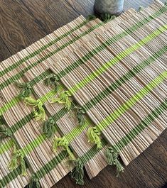 a close up of a table with green and white striped material on top of it