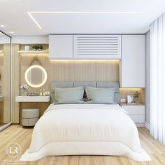 a white bed sitting next to a bathroom with a sink and mirror on the wall