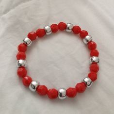 This Red Beaded Statement Bracelet Is Essential For The Spring And Summer Time Season It Is A Must Have For Anyone Who Loves Jewelry And Beautiful Accessories Hand Crafted With Red Crystals And Silver Metallic Beads Durable Stretchy Elastic Cord And Hypoallergenic Materials This Bracelet Would Be Great To Wear On Vacation Or For Date Night Modern With A Touch Of Elegance The Jewelry Would Make A Wonderful Gift For Yourself Or Someone You Care About Each Piece Is Rare And One Of A Kind Contact Me Red Adjustable Stretch Bracelet For Holidays, Adjustable Red Stretch Bracelet For Holiday, Red Beaded Bracelets With Silver Beads For Gifts, Gift Red Beaded Bracelets With Silver Beads, Casual Red Bracelets For Party, Lava Rock Bracelet, Lovers Bracelet, Beautiful Accessories, Awareness Bracelet