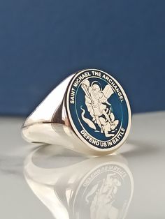 a close up of a ring on a table with a blue wall in the background