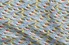 a blue fabric with birds on it and red spots in the center, as well as gold trimmings