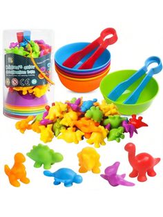 colorful plastic toys and bowls are on the white background, including spoons and forks