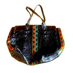 Rare Colleen Cordero Beautiful Black Leather Tote With Stuffing And Orange And Teal Aztec Decoration. Perfect Large Size For Travel Or Everyday Use. See Photos For Measurements. 17 Inches Across 13 Inches From Top To Bottom. Rare Style, No Longer Available. Brand New Condition, Spotless Inside And Out, Never Used. See Photos. Black Pouch Bag With Leather Handles, Traditional Black Rectangular Bag, Traditional Black Bag For Everyday Use, Traditional Black Rectangular Shoulder Bag, Multicolor Leather Satchel With Adjustable Strap, Multicolor Leather Crossbody Satchel, Black Leather Pouch Shoulder Bag, Multicolor Leather Tote Shoulder Bag, Multicolor Leather Shoulder Bag With Double Handle