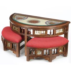 two wooden tables with red cushions on each side and an oval table in the middle