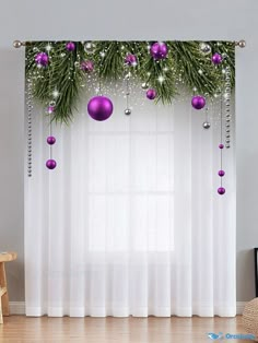 christmas decorations are hanging on the window curtain