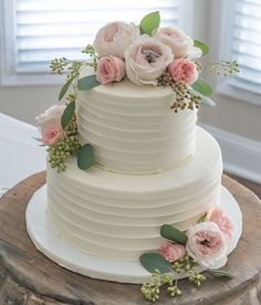 a white wedding cake with pink flowers on top and the words read it save $ 10