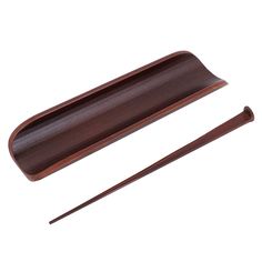 two chopsticks and a wooden tray on a white background