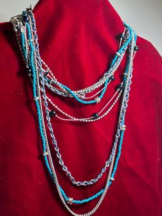 Lia Sophia 5 strand of beads which can be removed from the clasp and worn in different ways for layering. Silvertone chains, black beads, turquoise beads, silvertone beads. Blue Beaded Multi-strand Layered Necklace, Multi-strand Metal Beads Jewelry, Blue Multi-strand Beaded Layered Necklace, Multi-strand Polished Turquoise Beads, Silver Multi-strand Bohemian Beads, Turquoise Multi-strand Beads For Jewelry Making, Turquoise Multi-strand Polished Beads, Silver Bohemian Multi-strand Beads, Turquoise Multi-strand Beaded Necklace