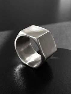 "A unisex industrial hexagonal stainless steel ring made of a real hardware nut. A wide, chunky, geometric band with an edge to it. Perfectly smooth inside. The ring is 0.5\" (1.3 cm) wide. US sizes available for this width are 6 - 10.5. Sizes 11 - 14 are available here: https://www.etsy.com/listing/155354355 Sizes 4.5 - 5.5 are available here: https://www.etsy.com/listing/464852845 Keep in mind that the smaller the ring size (in this particular size range), the thicker the ring sides, and vise Metal Jewelry Making, Metal Jewellery, Flagstaff Az, Metalsmithing Jewelry, Hex Nut, How To Make Rings, Diy Rings, Stainless Steel Ring, Welding Art