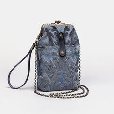 Enhance your style and functionality with this improved Phone Case design! Now featuring mini rings on both sides of the clasp, this bag comes with a convenient 60" detachable chain with hooks, allowing you to effortlessly switch it to a crossbody bag for ultimate versatility. Crafted from a combination of burnout velvet, cotton floral canvas, and a sturdy brass clasp with a double kiss lock, this Phone Case is part of my classic and durable clasp collection. Handmade with attention to detail, i Blue Mobile Phone Evening Bag, Vintage Crossbody Bag With Metal Hardware, Vintage Rectangular Shoulder Bag For Everyday Use, Elegant Handheld Pouch With Cell Phone Pocket, Elegant Blue Shoulder Bag With Cell Phone Pocket, Vintage Rectangular Phone Bag With Adjustable Strap, Vintage Rectangular Case Bag For Everyday Use, Vintage Phone Bag With Removable Pouch For Travel, Vintage Phone Bag For Everyday Use