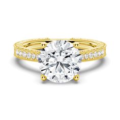 a yellow gold engagement ring with diamonds on the band and an oval cut diamond in the center