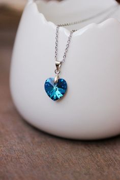 This lovely delicate necklace was made of finest quality European crystal blue heart pendant, silver tone bail, steel jumping rings, stainless steel chain with stainless steel lobster claw. The chain is from lead free & nickel free metal. Perfect for everyday wear and a great gift! The length of chain is about 46 cm or about 18,1 inches and 4 cm of adjustable length chain. Other necklaces of my shop you can see here: https://www.etsy.com/shop/NaTavelli?section_id=14843046&ref=shopsection_leftnav Blue Sterling Silver Charm Necklace With Lobster Clasp, Blue Heart Charm Pendant Necklaces, Blue Heart Pendant Charm Necklace For Gift, Blue Heart Charm Necklace For Gift, Blue Nickel-free Heart Pendant Jewelry, Sapphire Heart Sterling Silver Necklace, Sapphire Heart Necklace In Sterling Silver, Heart-shaped Sapphire Necklace In Sterling Silver, Blue Necklace With Heart Charm And Round Pendant