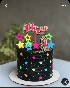 a birthday cake with stars and the number nine on it