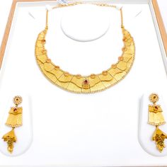 PRODUCT DETAILS Gold Purity(karat): 22k Item Weight(grams): 82.5 Item Finish: Antique Finish Stone: Kundan Set Length: 17" Adjustable Links: 1.5" Links Lock Style: Hook Lock Matching Earrings: Included Earring Length: 2.5" Earring Post: Screw Back Gold Plated Yellow Gold Kundan Necklace, Hand Set Yellow Gold Plated Kundan Necklace, Hand Set Yellow Gold-plated Kundan Necklace, Gold Kundan Necklace With Elegant Design For Formal Occasions, Gold Kundan Necklace With Elegant Design For Formal Events, Ceremonial Gold Kundan Necklace Hand Set, Yellow 22k Gold Necklaces For Anniversary, Yellow Gold Round Kundan Necklace In Temple Style, Yellow Gold Round Kundan Necklace Temple Jewelry