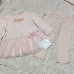 New With Tags Little Me Signature Collection Matching Outfit. Size 9 Months. Adorable Pink Outfit With Gold Accents. Long Sleeve Top Is Pink With Small Glittery Gold Dots, Gold Accented Flowers And A Double Layered Tutu Style Bottom. Pants Are Pink With Glittery Gold Horizontal Lines And Gold Accented Bows At The Ankles. This Was Originally Supposed To Be A 3-Piece Set And Include A Headband, But The Headband Is Missing. Sweet Pink Long Sleeve Sets, Sweet Long Sleeve Pink Sets, Sweet Pink Cotton Sets, Pink Sets For First Birthday In Spring, Pink First Birthday Sets For Spring, Cute Pink First Birthday Sets, Sweet Sets For Spring Playtime, Cute Pink Playtime Sets, Sweet Playtime Sets For Spring