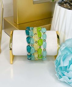 Elevate your wrist game with our Skipping Stones Bracelet Set in green – a vibrant and boho-inspired collection featuring 5 Row Ugly Stone Beaded Bracelets. This stretch bracelet set is perfect for those who love to embrace the beauty of natural stones in a trendy and eclectic design. Stone Beaded Bracelets, Skipping Stones, Black Friday Christmas, Stacking Bracelets, Beach Birthday, Wrist Game, Colored Stone, Green A, Eclectic Design