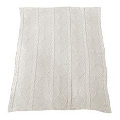 a white knitted blanket on a white background