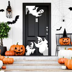 halloween decorations on the front steps of a house with pumpkins and jack - o'- lanterns