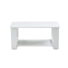 a white coffee table sitting on top of a white floor