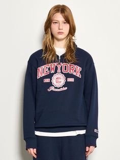 This is a comfortable and casual crewneck sweatshirt that is made out of sturdy cotton and polyester blend fabric. With a minimal yet unique design of graphic print on the front chest and logo emblem embroidered on the left cuff, it gives a casual and trendy look. - Half zipper on the neckline- Graphic print on the front chest- Logo emblem embroidery on the sleeve- Relaxed silhouette Collegiate Hoodie With Logo Print And Crew Neck, Collegiate Crew Neck Hoodie With Logo Print, Blue Graphic Print Sweatshirt For Campus, Urban Hoodie With Embroidered Logo And Crew Neck, Sporty Crew Hoodie With Text Print, College Style Sweatshirt With Logo Print And Crew Neck, Varsity Graphic Print Hoodie With Crew Neck, Varsity Crew Neck Hoodie With Graphic Print, Winter College Style Sweatshirt With Logo Print