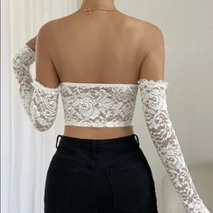 Steal the limelight with our beautiful underwire strapless crop top in solid white color. Designed to offer unmatched comfort, the top has an underwire support that keeps you secure throughout the day. But that's not all! The highlight of the crop top are its lace sleeves, bringing in an element of delicacy and charm to your look. Perfect for pairing with high waisted jeans or a chic skirt, it is an absolute must-have for your summer wardrobe! Color: WhiteSleeve Length: LongSilhouette: SheathType: Crop TopMaterial: PolyesterDecoration: LaceImported Update: This product is in high demand so you may experience a slight delay in shipping OUR PROMISE TO YOU: Easy Refunds. Buyer Protection. 30 Day Returns.Tracking Number for Every Order.Safe & secured payments via PayPal® & Shopify Payments whi White Off-shoulder Tube Top For Night Out, White Fitted Tube Top With Built-in Bra, White Off-shoulder Crop Top For Parties, White Stretch Crop Tube Top, White Strapless Bra-friendly Tops, White Strapless Bra Friendly Tops, White Strapless Top Bra Friendly, White Fitted Strapless Crop Top, White Stretch Tube Top For Night Out