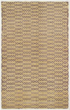 a beige and brown rug with an intricate design