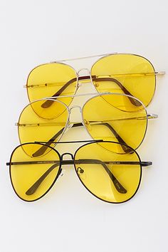 Big '70s vibes with theses yellow lens sunglasses and oversized frame Approx. size: 2.2" x 6" Metal frame Luxury Yellow Vintage Sunglasses, Luxury Yellow Gold Mirrored Sunglasses, Luxury Vintage Gold Aviator Sunglasses, Trendy Yellow Aviator Sunglasses With Uv Protection, Trendy Yellow Aviator Sunglasses With Polarized Lenses, Trendy Yellow Polarized Aviator Sunglasses, Casual Yellow Aviator Sunglasses With Tinted Lenses, Casual Yellow Tinted Aviator Sunglasses, Summer Yellow Sunglasses With Mirrored Lenses