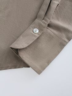 Enhance your summer wardrobe with our Linen Blouse-Olive. The loose fit and relaxed design will keep you looking stylish while keeping you cool. Perfect for any casual or formal occasion. Beige Solid Color Workwear Shirt, Beige Solid Workwear Shirt, Beige Solid Color Shirt For Work, Beige Workwear Shirt, Casual Beige Tops With Roll-up Sleeves, Casual Beige Top With Button Cuffs, Casual Beige Tops With Button Cuffs, Solid Color Shirt For Workwear In Summer, Solid Color Shirt For Summer Workwear