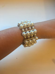 Pearl, diamanté, gold stretchy glamorous wrist bracelet. Evening Pearl Bracelet Jewelry, Glamorous Gold Cuff Bracelet For Party, Party Pearl Bracelets With Pearl Chain, Party Pearl Bracelet With Beaded Details, Pearl Bracelets For Party, Silver Pearl Bracelet For Party, Pearl Embellished Party Bracelet, Party Pearl Beaded Bracelet, White Bangle Bracelet For Evening